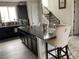 Stylish kitchen island with granite countertop and comfortable seating at 2617 Channel Dr, Highlands Ranch, CO 80129