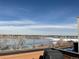 Relaxing frozen lake view from a balcony, featuring clear skies, with nearby trees adding a touch of nature at 2617 Channel Dr, Highlands Ranch, CO 80129