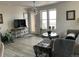 Bright living room with a stylish chandelier, modern furniture, and large windows at 2617 Channel Dr, Highlands Ranch, CO 80129