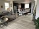 Spacious open floor plan featuring living room, kitchen, and dining area with modern decor at 2617 Channel Dr, Highlands Ranch, CO 80129