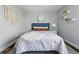 Comfortable bedroom featuring gray walls, hardwood floors and decor at 557 S Clarkson St, Denver, CO 80209