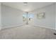 Bright and airy bedroom with two windows, neutral carpet and wall mirror at 557 S Clarkson St, Denver, CO 80209
