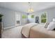 Light-filled bedroom featuring a patio door, and soft neutral decor at 557 S Clarkson St, Denver, CO 80209