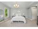 Serene bedroom features neutral colors, ambient lighting, and plush carpeting at 557 S Clarkson St, Denver, CO 80209