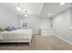 Bright bedroom featuring neutral tones, carpet flooring, and a double-hung window for natural light at 557 S Clarkson St, Denver, CO 80209