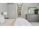 Bedroom with neutral colors, dresser and view of hall at 557 S Clarkson St, Denver, CO 80209