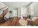Welcoming entryway with staircase, hardwood floors, and plenty of natural light at 557 S Clarkson St, Denver, CO 80209