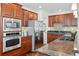 Well-equipped kitchen with stainless steel appliances, granite counters, and ample cabinet space at 557 S Clarkson St, Denver, CO 80209
