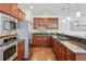 Updated kitchen with granite countertops, stainless steel appliances, and beautiful wood cabinets at 557 S Clarkson St, Denver, CO 80209