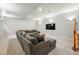 Finished basement space with plush seating, recessed lighting, and a large screen TV at 557 S Clarkson St, Denver, CO 80209