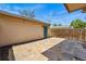 Outdoor patio featuring stone pavers, string lights, and a fenced perimeter for privacy and ambiance at 557 S Clarkson St, Denver, CO 80209