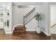 Beautiful staircase with wooden steps and banister, adjacent to fireplace at 557 S Clarkson St, Denver, CO 80209