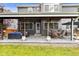 Large backyard featuring a covered patio with seating and a well-manicured lawn at 6772 Tiger Tooth, Littleton, CO 80124