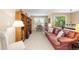Loft area with sofa, desk, and shelving with a view of the trees outside at 6772 Tiger Tooth, Littleton, CO 80124