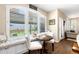 Breakfast nook featuring a window seat, shutters, small table, and natural light at 6772 Tiger Tooth, Littleton, CO 80124