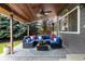 Inviting covered patio with comfortable seating and a wood-paneled ceiling at 6772 Tiger Tooth, Littleton, CO 80124