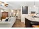 Bright living room features hardwood floors, fireplace, built-in shelving, and neutral decor at 6772 Tiger Tooth, Littleton, CO 80124