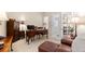 Bright office features french doors, a large desk, a comfortable chair, and ample storage space at 6772 Tiger Tooth, Littleton, CO 80124