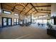 Large, open community clubhouse with modern finishes, a fireplace, and ample seating areas at 8628 Hotchkiss St, Littleton, CO 80125
