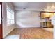 Spacious living area adjacent to the kitchen featuring hardwood floors and large windows at 3244 Foundry Pl, Boulder, CO 80301