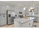 Modern kitchen with stainless steel appliances, granite countertops, and ample cabinet space, well lit with recessed lighting at 24555 E Ohio Dr, Aurora, CO 80018