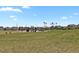 Community playground featuring various play structures, open green space, and nearby homes at 24555 E Ohio Dr, Aurora, CO 80018
