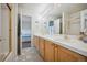 Bathroom with double vanity and view at 10520 W Vassar Dr, Denver, CO 80227