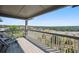 Deck overlooking cityscape and mountains at 10520 W Vassar Dr, Denver, CO 80227