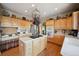 Well-equipped kitchen with ample cabinetry and island at 10520 W Vassar Dr, Denver, CO 80227