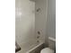 Bathroom featuring white subway tiling, a shower head, and modern fixtures at 6029 S Sycamore St, Littleton, CO 80120