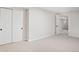 Spacious basement bedroom with carpeting and double doors at 7204 W 26Th Ave, Lakewood, CO 80214