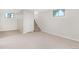 Finished basement with neutral carpet, ample space, and extra storage at 7204 W 26Th Ave, Lakewood, CO 80214