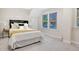 Spacious bedroom with a comfortable bed and large windows at 7204 W 26Th Ave, Lakewood, CO 80214