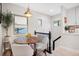 Cozy breakfast nook with a round wooden table and chairs at 7204 W 26Th Ave, Lakewood, CO 80214