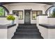 Charming home exterior with brick details and a welcoming front porch at 7204 W 26Th Ave, Lakewood, CO 80214