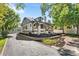 Craftsman style home with landscaping and a long driveway at 7204 W 26Th Ave, Lakewood, CO 80214