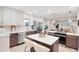 Modern kitchen featuring a center island, stainless steel appliances, and two-tone cabinets at 7204 W 26Th Ave, Lakewood, CO 80214