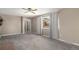 Bright living room offering large windows, neutral walls, carpeted flooring and traditional accents at 406 Titan Ct, Aurora, CO 80011