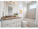 Modern bathroom with a double vanity, a bathtub, and elegant tile work throughout the shower at 2114 Lowell Blvd, Denver, CO 80211