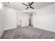 Spacious bedroom featuring neutral color palette, ceiling fan, and carpet flooring at 2114 Lowell Blvd, Denver, CO 80211
