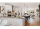 Open-concept kitchen with modern cabinetry, stainless steel appliances, and a large center island at 2114 Lowell Blvd, Denver, CO 80211