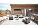 Outdoor patio with a built-in grill, comfortable seating, and patio heaters at 2114 Lowell Blvd, Denver, CO 80211