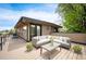 Outdoor roof deck with modern seating, wood-look decking, and views of surrounding neighborhood at 2114 Lowell Blvd, Denver, CO 80211