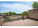 An outdoor deck featuring wood flooring and sleek black metal railings with neighborhood views, perfect for entertaining at 2114 Lowell Blvd, Denver, CO 80211