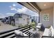 Cozy balcony with outdoor seating and a view of the neighborhood at 12225 W 57Th Pl, Arvada, CO 80002