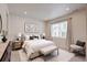 A serene main bedroom with carpet, a large window, and soft, neutral decor at 12225 W 57Th Pl, Arvada, CO 80002