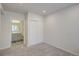 Bedroom featuring neutral walls, carpet and ensuite bath and large closet at 12225 W 57Th Pl, Arvada, CO 80002