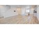 Open floor plan with a combined living and kitchen area, with hardwood floors throughout at 12225 W 57Th Pl, Arvada, CO 80002