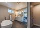 Elegant bathroom featuring a soaking tub, double vanity, and walk-in shower at 8695 Thunderbird Cir, Parker, CO 80134