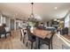 Bright dining area with a rustic wood table and modern chairs at 8695 Thunderbird Cir, Parker, CO 80134